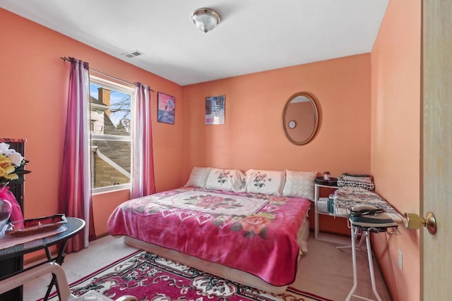 bedroom featuring visible vents and carpet