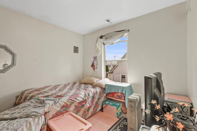 bedroom featuring visible vents