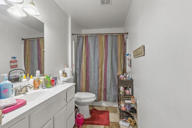 full bath with visible vents, toilet, curtained shower, and vanity