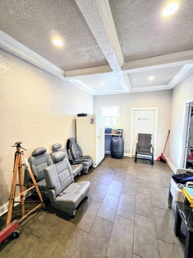 workout area featuring baseboards, coffered ceiling, recessed lighting, ornamental molding, and a textured ceiling