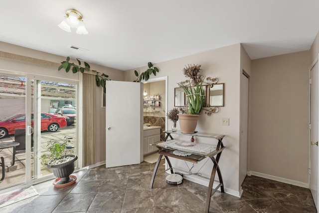 interior space featuring visible vents and baseboards