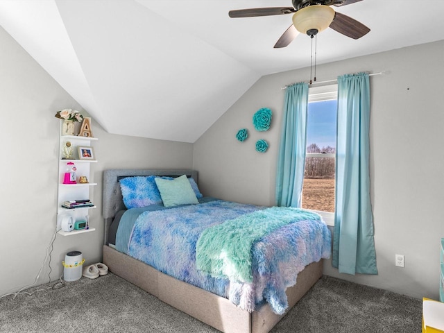 carpeted bedroom featuring a ceiling fan and vaulted ceiling