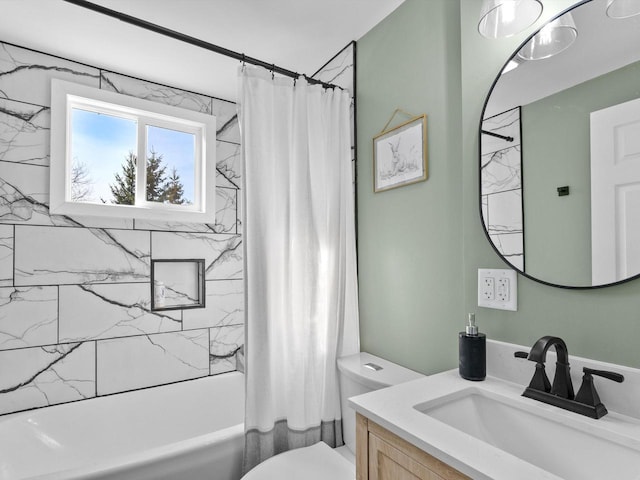 full bathroom featuring shower / tub combo with curtain, toilet, and vanity