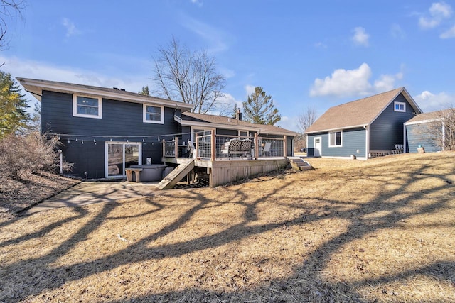 rear view of property with a deck