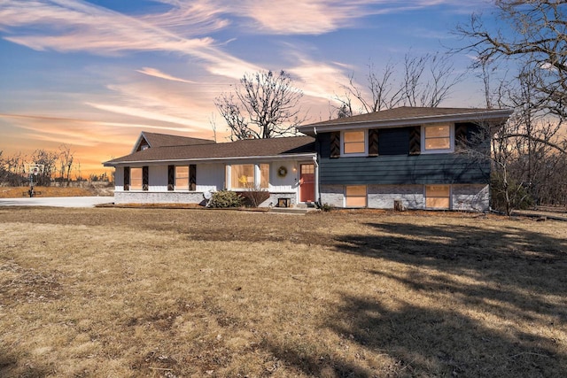 split level home with a front yard