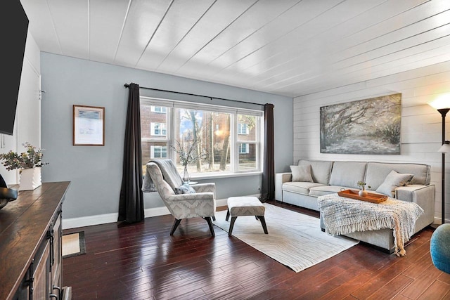 living room with baseboards and dark wood-style floors