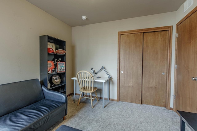 office space featuring carpet flooring, baseboards, and visible vents