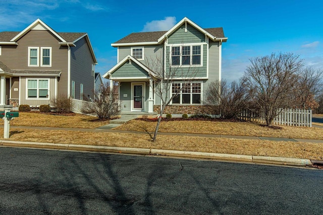 view of front of house with fence