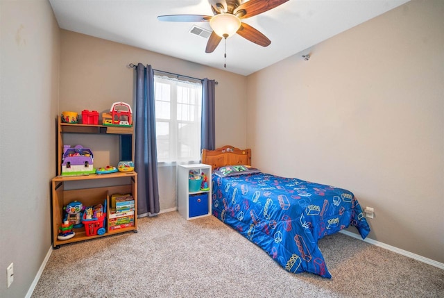 bedroom with visible vents, baseboards, carpet, and a ceiling fan