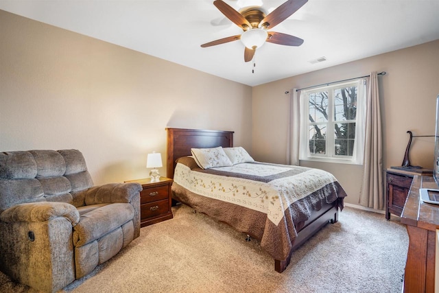 bedroom featuring light carpet, visible vents, baseboards, and a ceiling fan