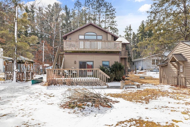 view of front of house featuring a deck and stairs