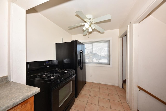 kitchen with ceiling fan, light countertops, brown cabinets, light tile patterned flooring, and black appliances