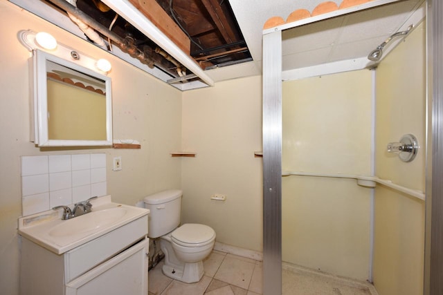 full bathroom with tile patterned flooring, backsplash, toilet, a stall shower, and vanity