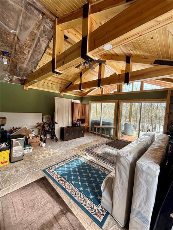 living area featuring vaulted ceiling with beams and wood ceiling