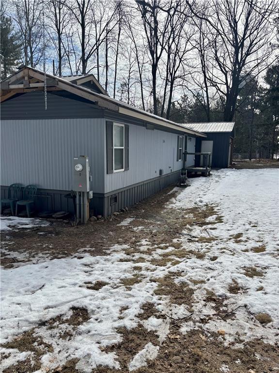 snow covered property with crawl space