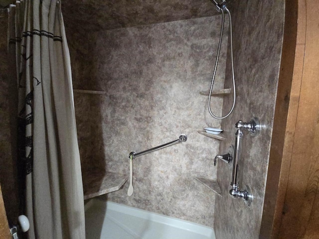 interior details featuring a shower with shower curtain