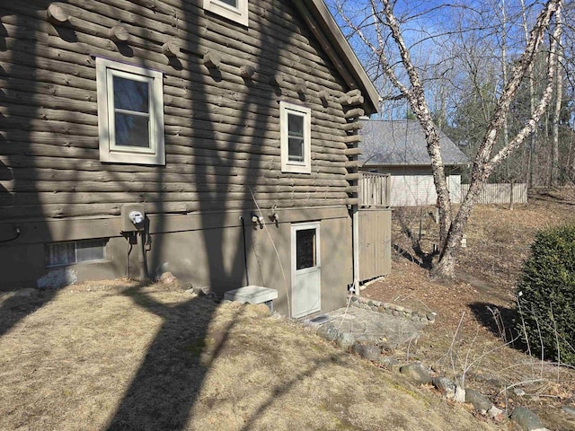 view of side of property featuring log siding