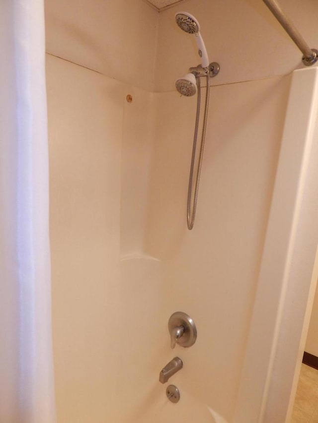 details featuring washtub / shower combination