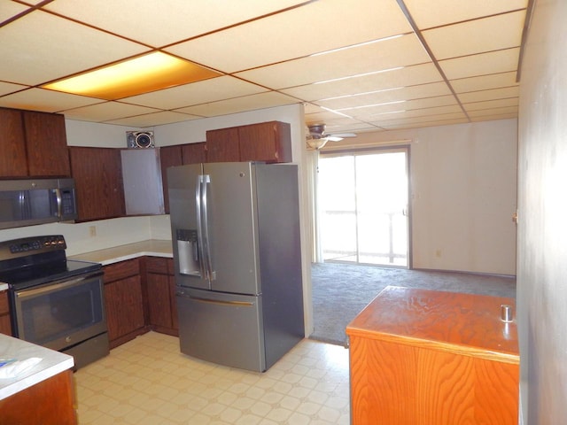 kitchen featuring visible vents, a drop ceiling, appliances with stainless steel finishes, light floors, and ceiling fan