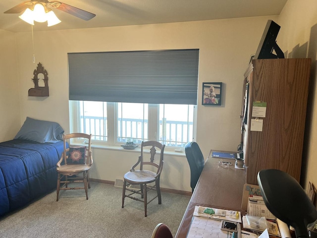 carpeted bedroom with baseboards and ceiling fan