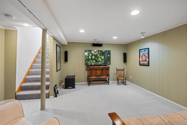 sitting room with stairway, baseboards, recessed lighting, ornamental molding, and carpet flooring