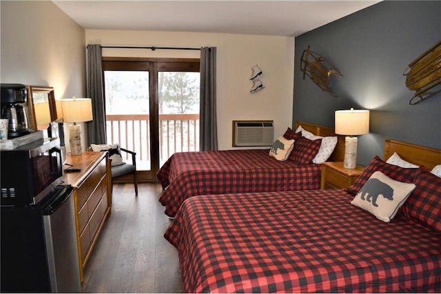 bedroom with access to outside, wood finished floors, and a wall mounted AC