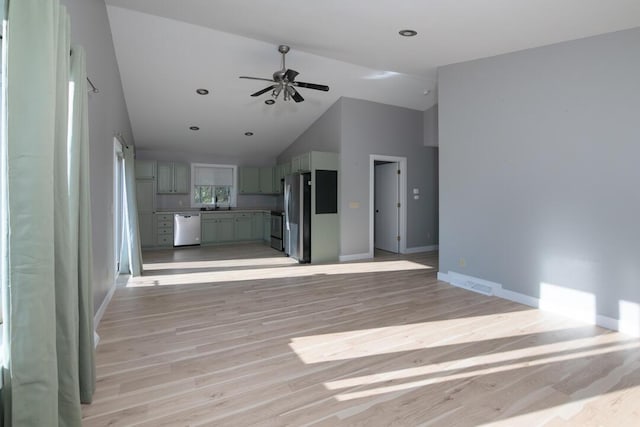 unfurnished living room featuring baseboards, light wood-type flooring, and ceiling fan