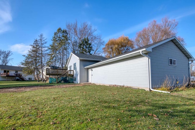 view of side of property with a yard