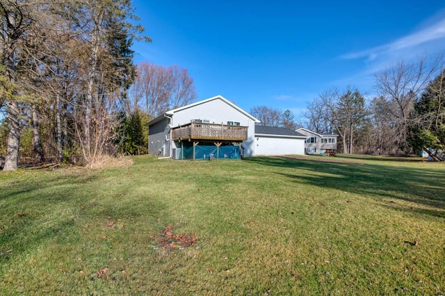 exterior space with a lawn and a deck