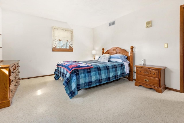 bedroom with baseboards and visible vents