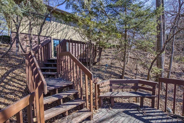 wooden terrace featuring stairs