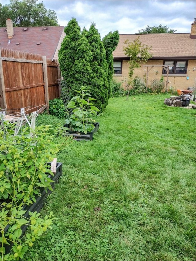 view of yard featuring a garden and fence