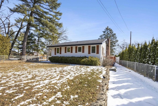 view of front of property featuring fence