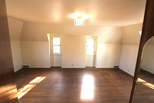 bonus room featuring visible vents, baseboards, and wood finished floors