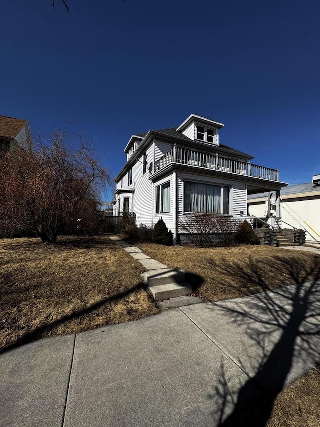 view of property exterior with a balcony