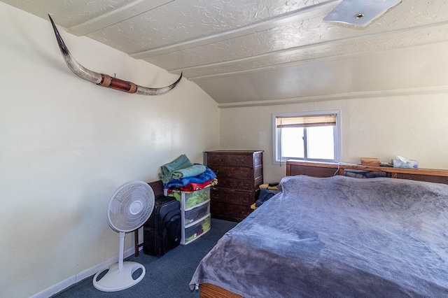 carpeted bedroom with baseboards and lofted ceiling