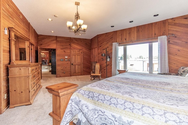 bedroom with recessed lighting, a notable chandelier, light carpet, and wooden walls