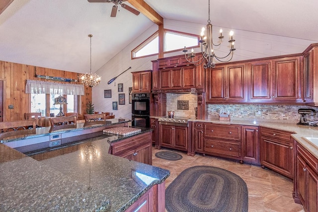 kitchen with high vaulted ceiling, beam ceiling, hanging light fixtures, wood walls, and dobule oven black