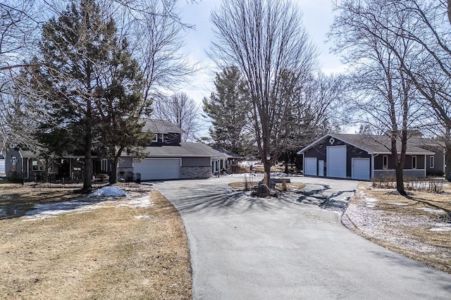 view of front of house with aphalt driveway and a garage