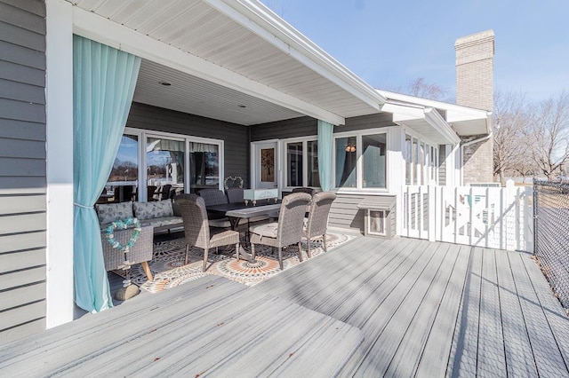 deck featuring outdoor lounge area