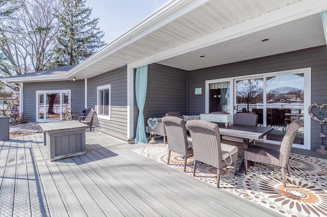 wooden deck with outdoor dining space