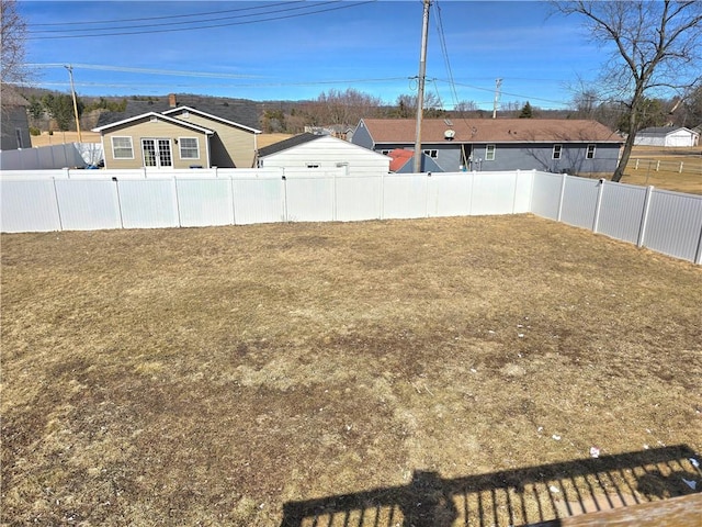 view of yard with a fenced backyard