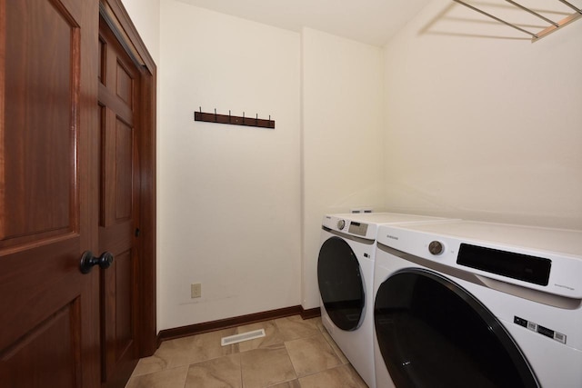 clothes washing area featuring visible vents, baseboards, light tile patterned floors, laundry area, and independent washer and dryer