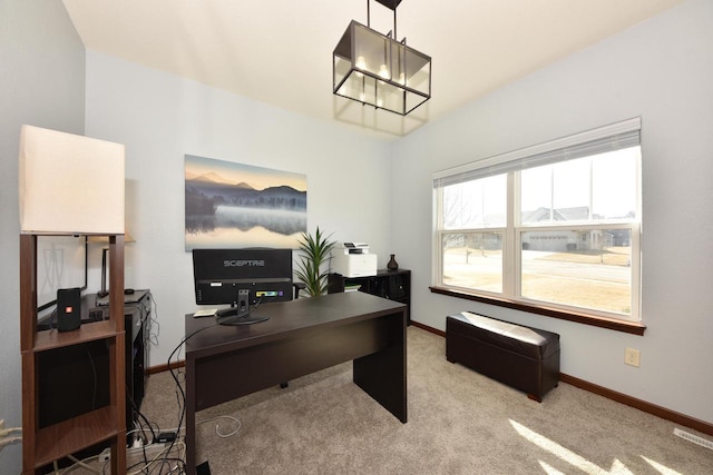 carpeted office featuring baseboards, lofted ceiling, and an inviting chandelier