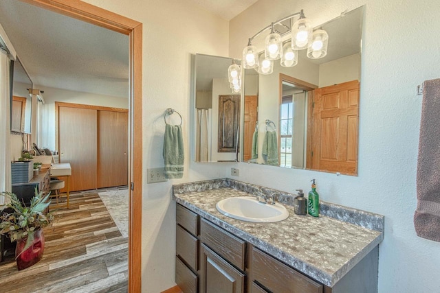 bathroom featuring vanity and wood finished floors