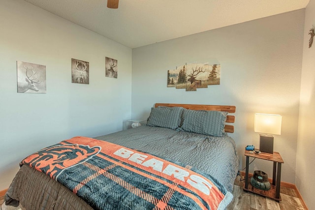 bedroom featuring ceiling fan and wood finished floors