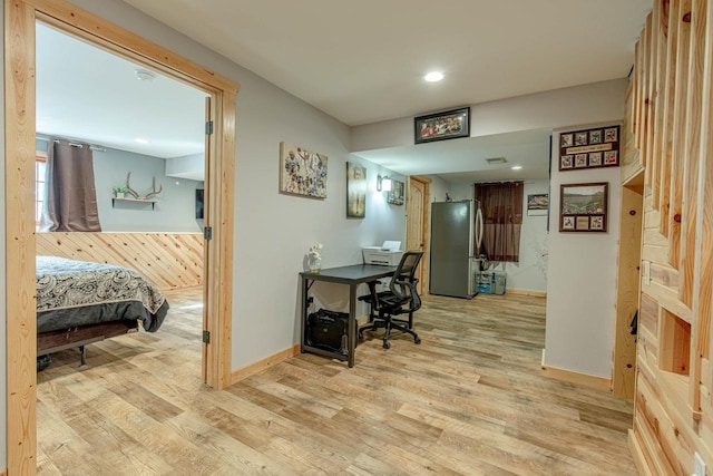 office area with baseboards and light wood-style floors