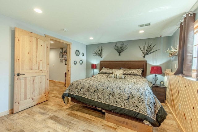 bedroom featuring recessed lighting, visible vents, baseboards, and wood finished floors