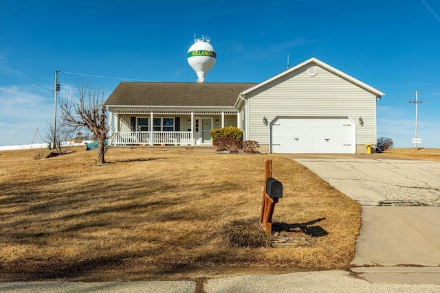 ranch-style home with a garage, a front yard, covered porch, and driveway