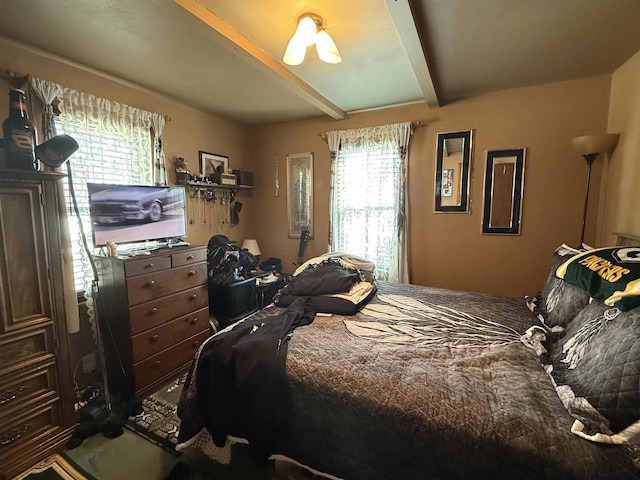 bedroom with beamed ceiling